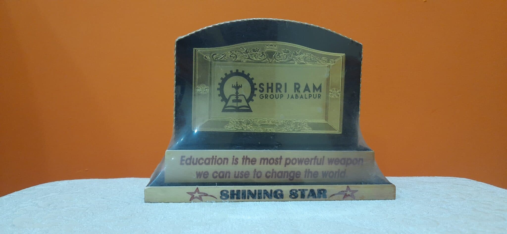 Award plaque with the national emblem presented to Sanjay Choubey